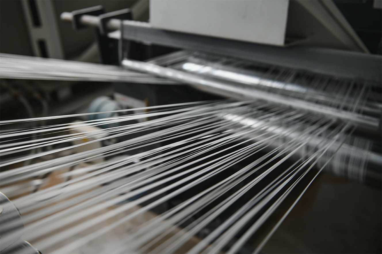 Production of polypropylene yarn for making bags.
